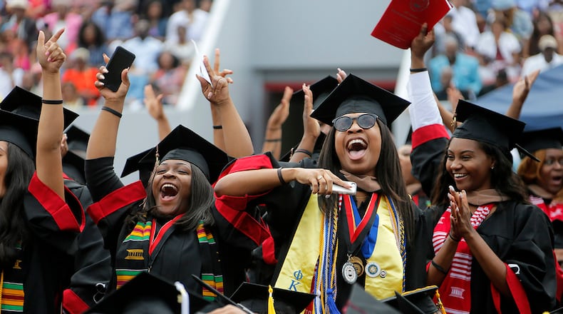 Graduates cheer during Clark Atlanta University's 2017 graduation ceremony. The future may be bright for these grads, but the future for some HBCU institutions is less certain. (BOB ANDRES /BANDRES@AJC.COM)