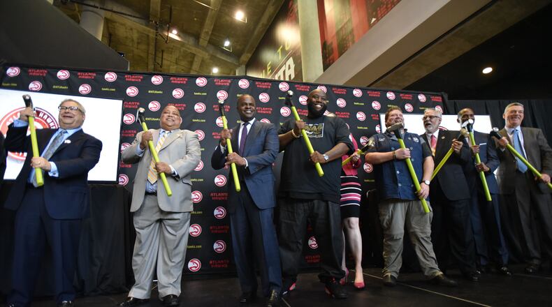 Atlanta Mayor Kasim Reed (center left), Killer Mike (center right) and other VIP guests pose with sledgehammers during a press conference announcing details of a $192.5 million update to Philips Arena in June. Fulton County Commission Chairman John Eaves was not in attendance. HYOSUB SHIN / HSHIN@AJC.COM