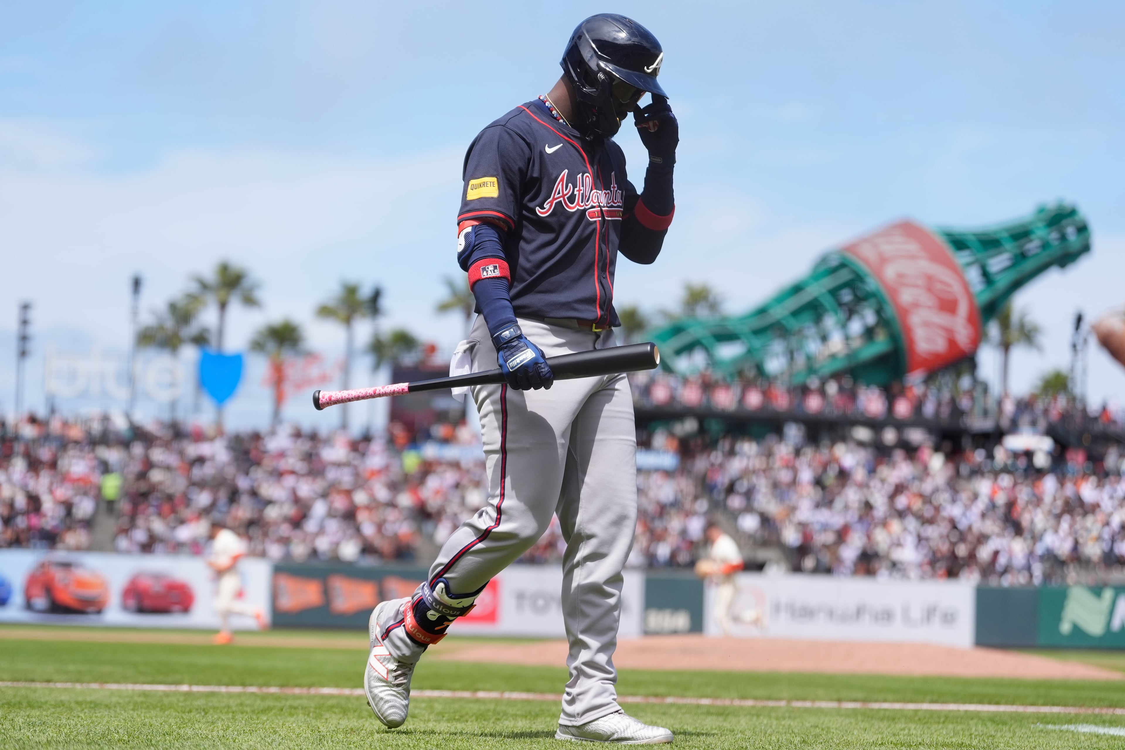 Atlanta Braves' Michael Harris II walks to the dugout after striking out against the San Francisco Giants during the eighth inning of a baseball game in San Francisco, Sunday, June 8, 2025. (AP Photo/Jeff Chiu)