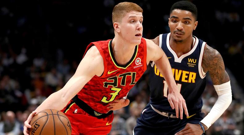 Kevin Huerter of the Atlanta Hawks drives against Gary Harrisof the Denver Nuggets in the first quarter at the Pepsi Center on November 12, 2019 in Denver, Colorado.