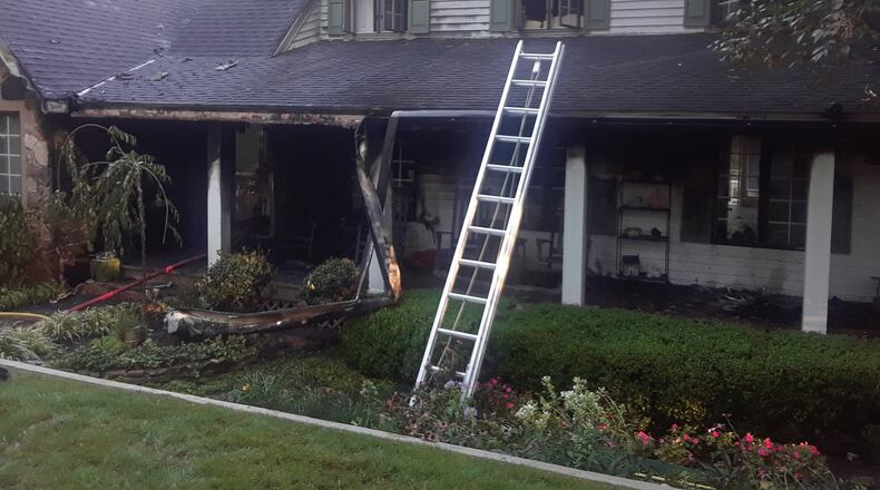 Fire damaged this house in Buford early Wednesday. Two dogs were found dead, according to a Gwinnett County fire department spokesman.