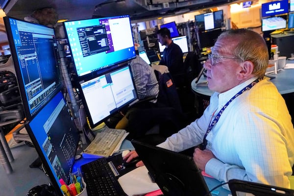 Trader Richard Cohen works on the floor of the New York Stock Exchange, Tuesday, July 8, 2025. (AP Photo/Richard Drew)