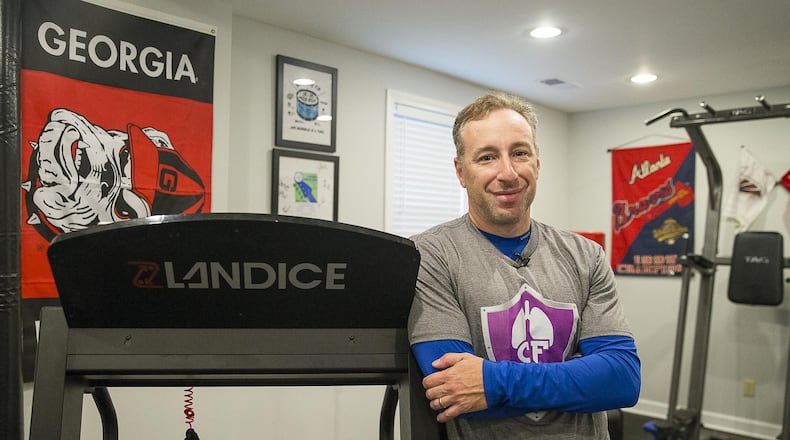 Andy Lipman in a workout room at his home. Despite being diagnosed with cystic fibrosis in childhood, he lived a full life and became a spokesman for not letting problems limit one's accomplishments. ALYSSA POINTER / ALYSSA.POINTER@AJC.COM