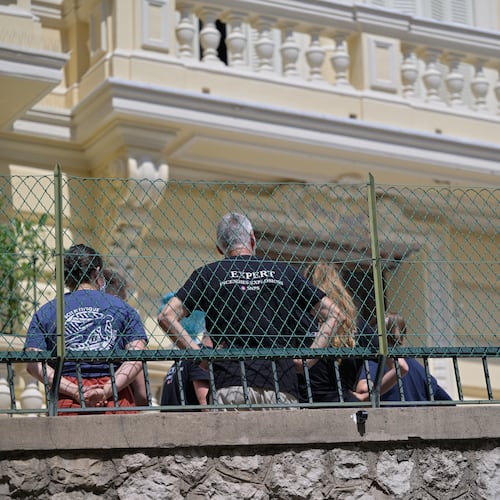 Investigators examine the scene at the residential building where an explosive device seriously injured three people a day earlier in Monaco, Tuesday, June 30, 2026. (AP Photo/Philippe Magoni)