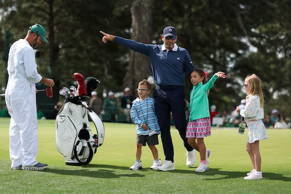 Sergio Garcia walks with his two children after he finished the seventh hole during a practice round at the Masters golf tournament, Monday, April 6, 2026, in Augusta, Ga. (Jason Getz/AJC) 