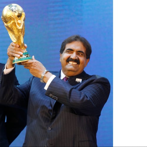 FILE - Sheikh Hamad bin Khalifa Al Thani, Emir of Qatar, holds the World Cup trophy after the announcement of Qatar hosting the 2022 soccer World Cup in Zurich, Switzerland, Dec. 2, 2010. (AP Photo/Anja Niedringhaus, File)
