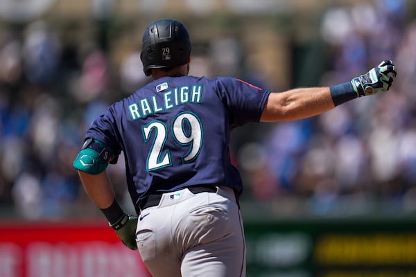 Seattle Mariners' Cal Raleigh runs the bases after hitting a two-run a home run during the seventh inning of a baseball game against the Chicago Cubs, Friday, June 20, 2025, in Chicago. (AP Photo/Erin Hooley)