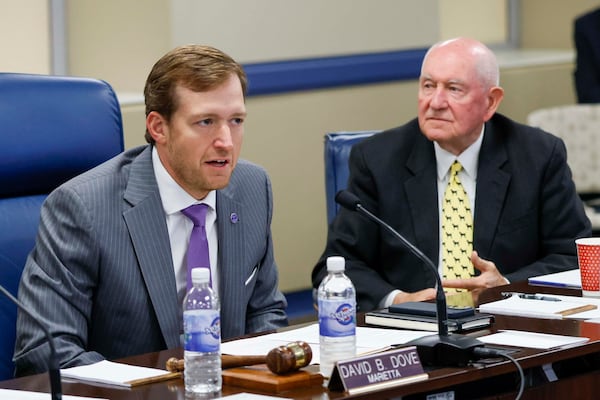 Chairman David B. Dove speaks as University System of Georgia Chancellor Sonny Perdue looks on during the Board of Regents meeting on Tuesday, May 12, 2026.
(Miguel Martinez/AJC)