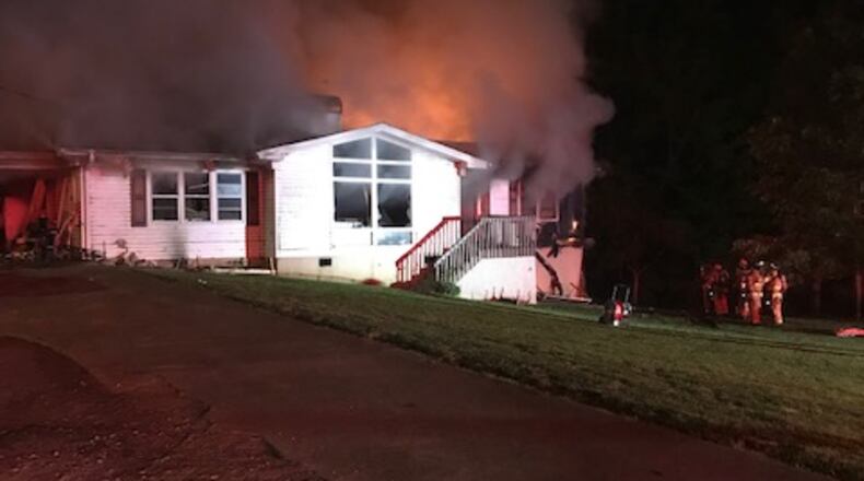 Seven people including three children are displaced and a dog was killed after a fire broke out at a home in Hall County, authorities said.