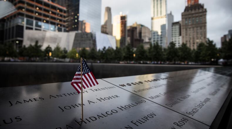 NEW YORK, NY - SEPTEMBER 11: An American flag sits posted at the 9-11 Memorial site on September 11, 2015 in New York City. Today marks the 14th anniversary of the attacks where nearly 3,000 people were killed in New York, Washington D.C. and Pennsylvania. (Photo by Andrew Burton/Getty Images)