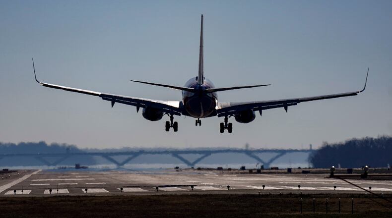 FILE - A plane lands at Ronald Reagan Washington National Airport in Arlington, Va., Dec. 30, 2022. (AP Photo/Carolyn Kaster, File)