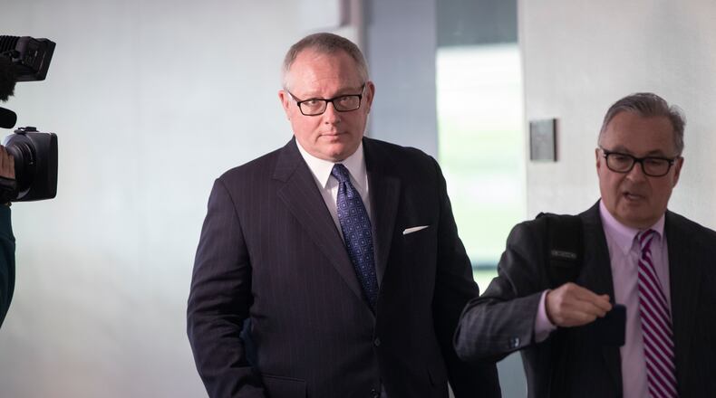 Michael Caputo, left, joined by his attorney Dennis C. Vacco, leaves after being interviewed by Senate Intelligence Committee staff investigating Russian meddling in the 2016 presidential election, on Capitol Hill in Washington. A House subcommittee examining President Donald Trump’s response to the coronavirus pandemic is launching an investigation into reports that political appointees have meddled with routine government scientific data to better align with Trump’s public statements.