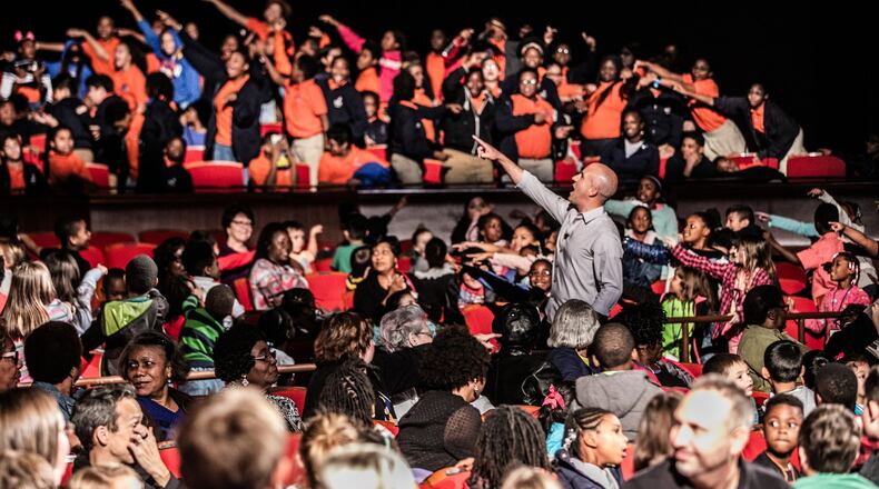 Magician Bill Blagg picks a member of the audience to help him to a magic trick during “The Science of Magic,” part ofthe ArtsBridge field trip season Wednesday, Oct. 23 at the Cobb Energy Performing Arts Centre. The nonprofit engages about 35,000 students every year with live theater performances that educate as well as entertain. COURTESY OF Chris Savas for ArtsBridge Foundation.