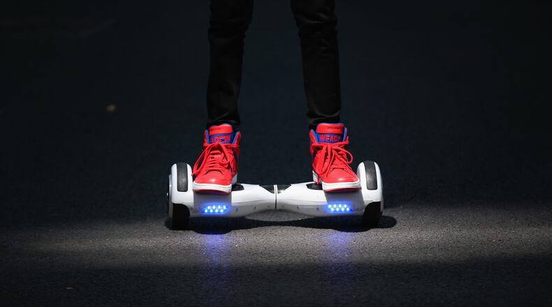 KNUTSFORD, ENGLAND - OCTOBER 13: A youth poses as he rides a hoverboard, which are also known as self-balancing scooters and balance boards, on October 13, 2015 in Knutsford, England. The British Crown Prosecution Service have declared that the devices are illegal as they are are too unsafe to ride on the road, and too dangerous to ride on the pavement. (Photo by Christopher Furlong/Getty Images)