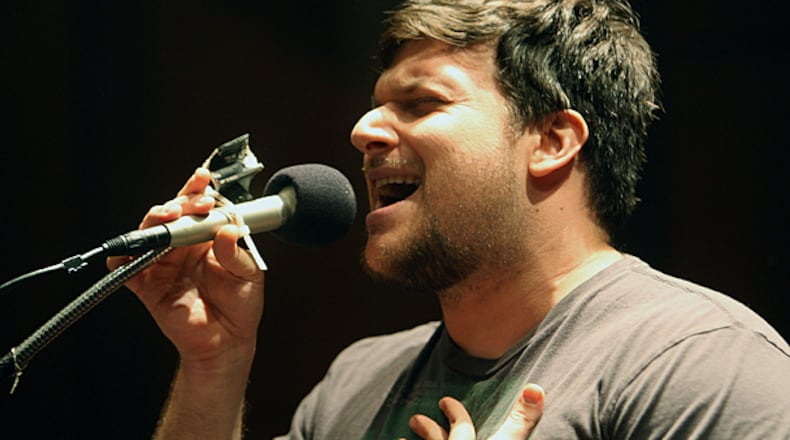 Matthew Cardinale belts out a tune in reference to the Atlanta City Council not doing enough for the elderly during a council meeting. (Credit: Vino Wong / AJC File)