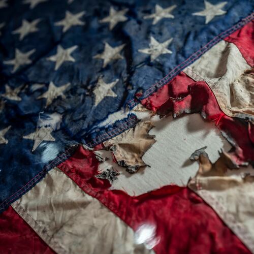 A badly damaged flag recovered from the World Trade Center debris is displayed at the Smithsonian's National Museum of American History, the nation's official repository for September 11 materials, in Washington, Thursday, Sept. 10, 2026. (AP Photo/J. Scott Applewhite)