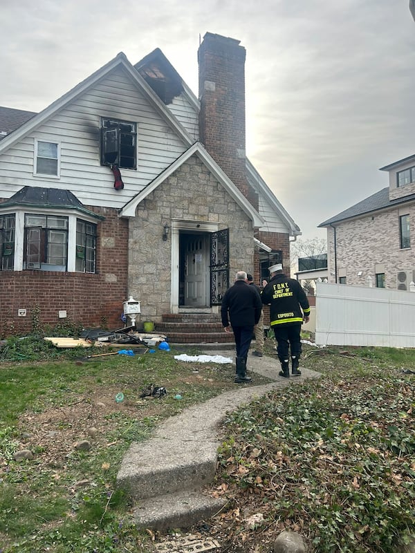 This image released by the New York City Fire Department shows damage after a deadly house fire killed several people in the Queens borough of New York, Sunday, April 20, 2025. (New York City Fire Department via AP)