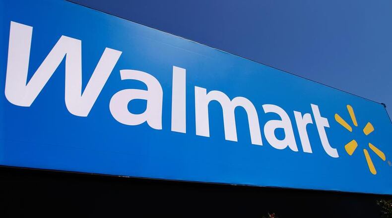 Five metro Atlanta Walmart stores have moved up their closing times from 11 p.m. to 9 p.m. (AJC file photo)
