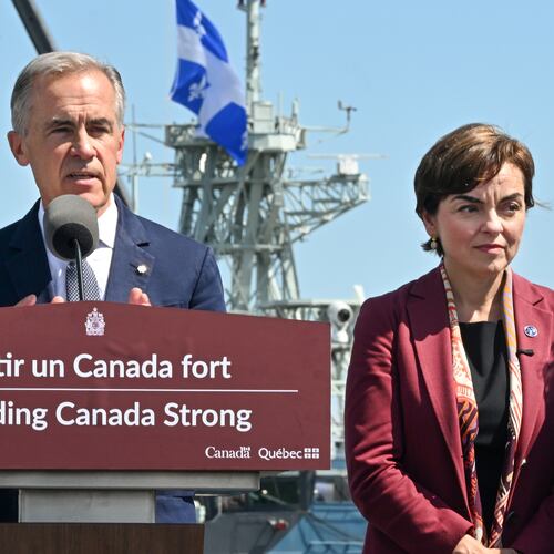 Canadian Prime Minister Mark Carney speaks as he announces a $11.3 billion contract for icebreakers at the Davie shipyard in Levis, Quebec on Monday, Aug. 24, 2026. Quebec Premier Christine Frechette, right, looks on. (Jacques Boissinot/The Canadian Press via AP)