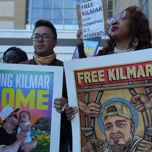 FILE - Activists rally outside of the U.S. District Court District of Maryland ahead of an evidentiary hearing where attorneys for Kilmar Abrego Garcia will seek his immediate release from immigration detention, Oct. 10, 2025, in Greenbelt, Md. (AP Photo/Stephanie Scarbrough, File)