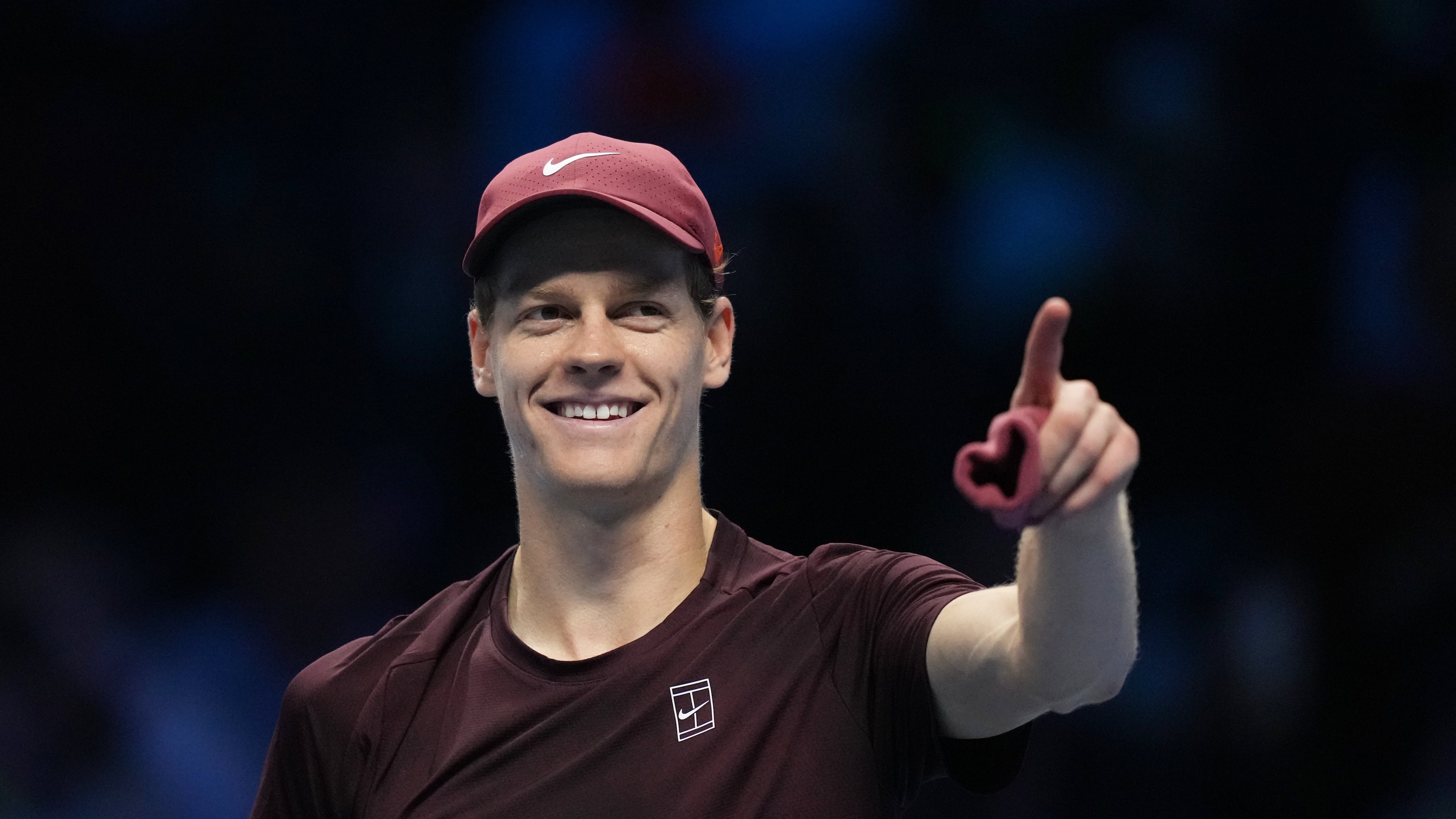 Italy's Jannik Sinner celebrates after winning against Canada's Felix Auger-Aliassime during their tennis match of the ATP World Tour Finals, in Turin, Italy, Monday, Nov. 10, 2025. (AP Photo/Antonio Calanni)