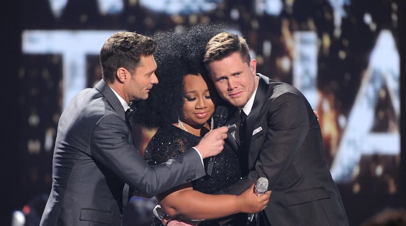 HOLLYWOOD, CA - APRIL 7: Judge Ryan Seacrest (L) announces American Idol Season 15 winner Trent Harmon (R) with runner-up La'Porsha Renae, onstage at FOX's American Idol Season 15 Finale on April 7, 2016 at the Dolby Theatre in Hollywood, California. (Photo by FOX via Getty Images) *** Local Caption *** Ryan Seacrest; La'Porsha Renae; Trent Harmon