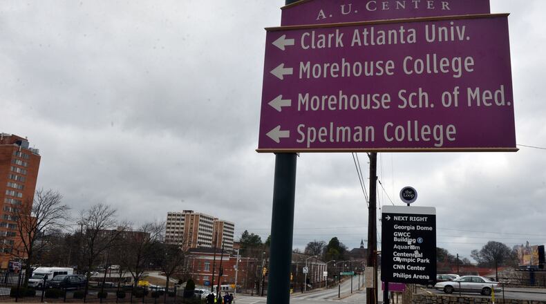 Signs point to the Atlanta University Center area along Martin Luther King Jr Drive.