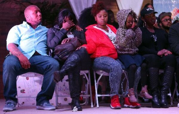 Members of Bobby Brown's family at the vigil. Leolah is seated at the far right. AJC photo by Ben Gray