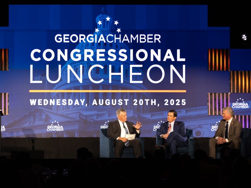 Left to right: Former U.S. Rep Drew Ferguson and U.S. Reps. Austin Scott and Mike Collins at the Georgia Chamber Congressional Luncheon in Columbus on Wednesday.
