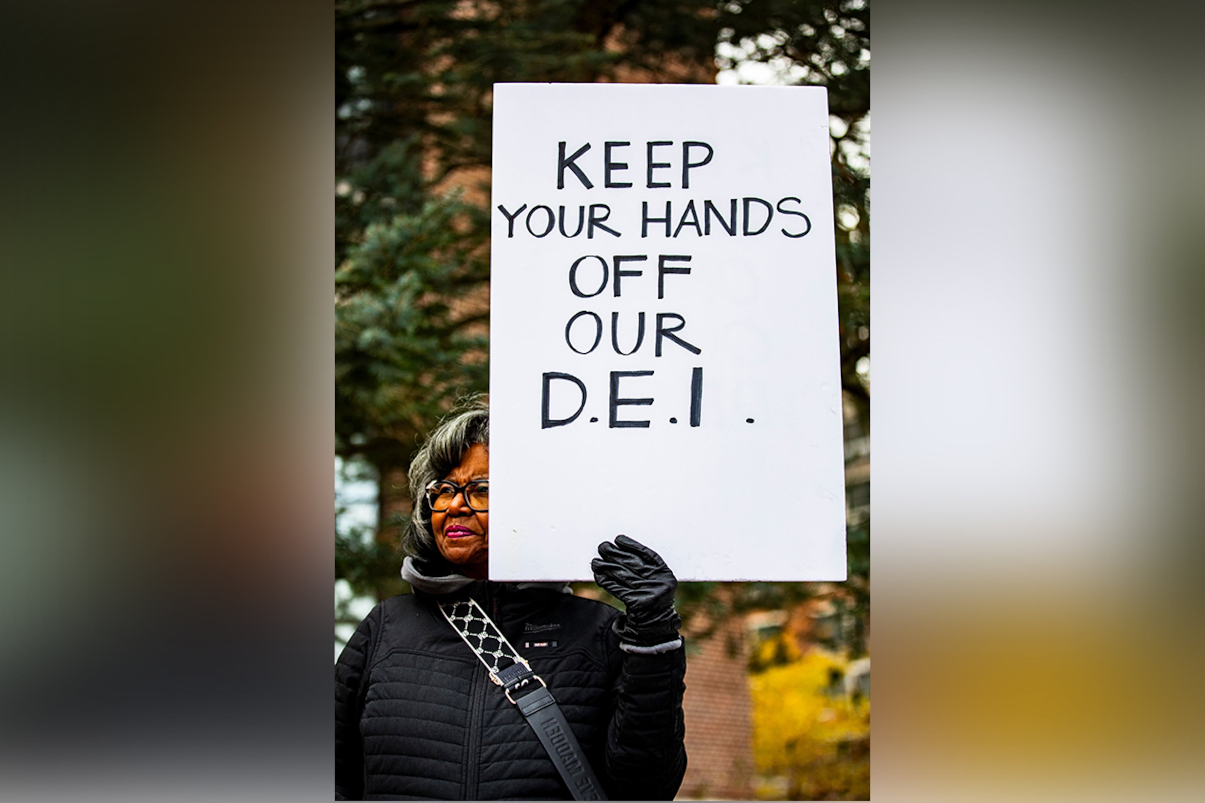 A sign is held up during a rally to protect funding for Diversity Equity and Inclusion at the University of Michigan in Ann Arbor, Mich., Dec. 2, 2024. (Emily Elconin/The New York Times)