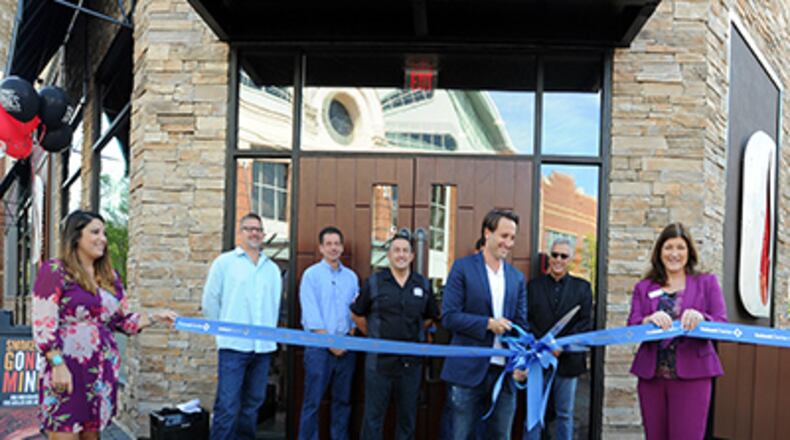 The Gwinnett Chamber, county ambassadors, Mall of Georgia representatives and the Smokey Bones team celebrated its grand opening and ribbon cutting on Aug. 15. (Photo: Gwinnett Chamber of Commerce)