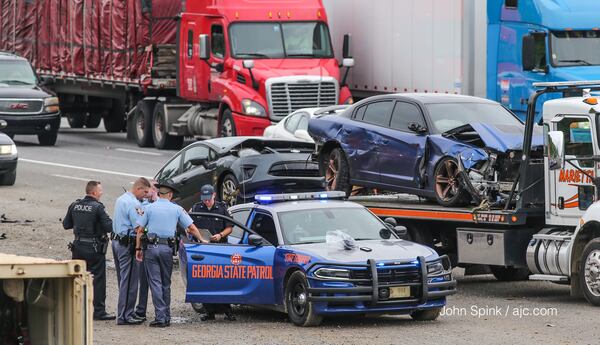 Authorities investigated a chase Wednesday morning on I-75 southbound in Cobb County. JOHN SPINK / JSPINK@AJC.COM