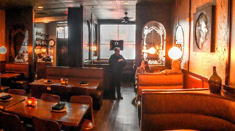 The interior of Pero’s Pizza & Pasta on Northside Parkway is dark, but cozy. Chris Hunt for The Atlanta Journal-Constitution