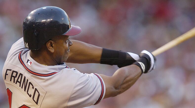 The Braves’ Julio Franco hits a two-run home run off Cincinnati Reds pitcher Eric Milton in the third inning on Saturday, June 18, 2005, in Cincinnati. (AP file photo)