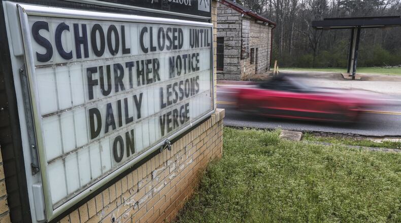 A sign at Murphey Candler Elementary School in Lithonia, DeKalb County on Wednesday, March 18, 2020. A group of 72 school and state leaders were appointed this week to begin planning for how Georgia schools will operate in the fall. JOHN SPINK/JSPINK@AJC.COM