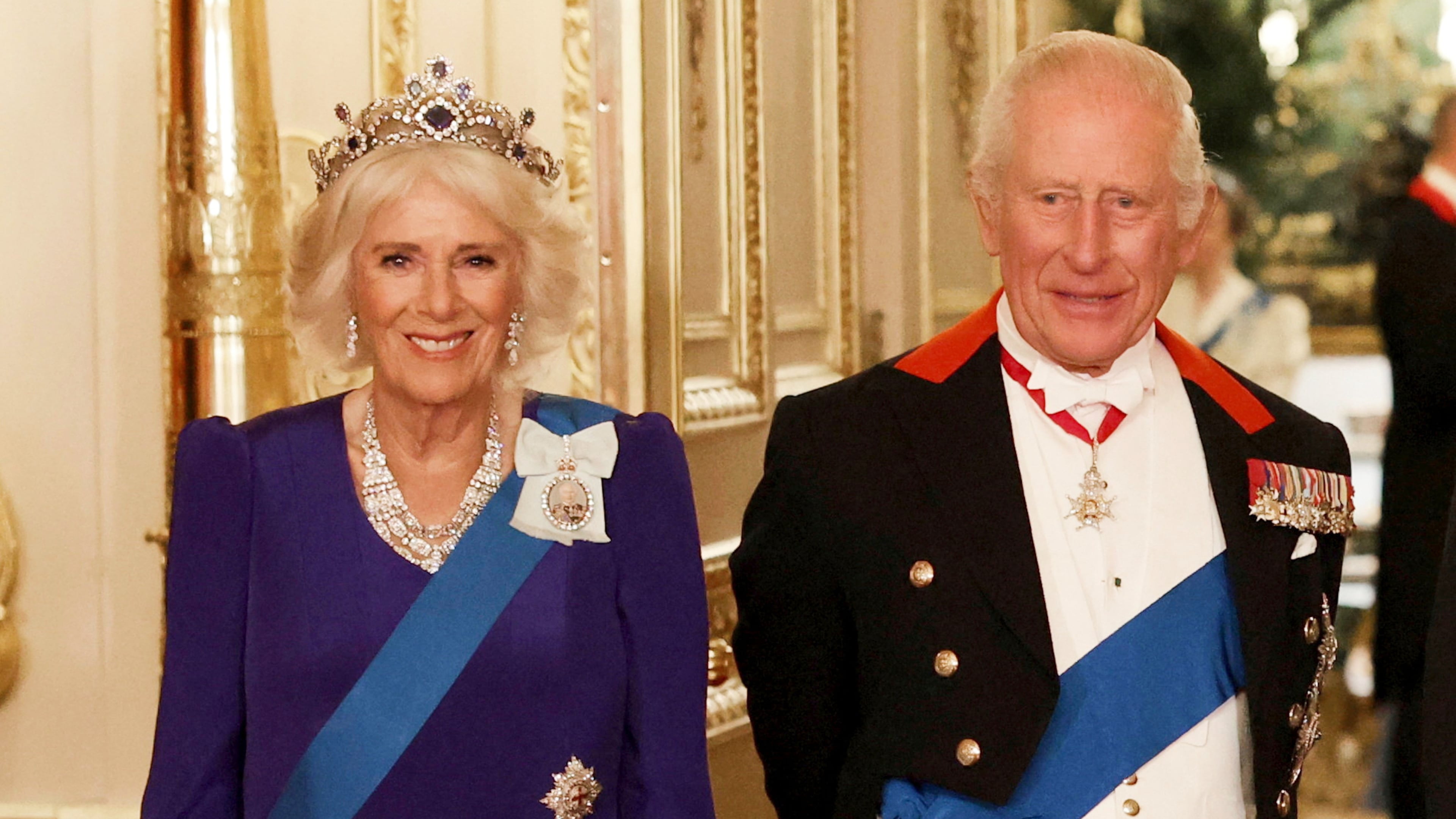 FILE - Britain's Queen Camilla, left, and King Charles III, right, pose for a photo before a State Banquet at Windsor Castle, in Windsor, England, Sept. 17, 2025. (Phil Noble/Pool Photo via AP, file)