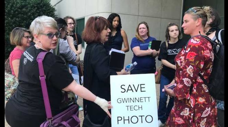About a dozen supporters of Gwinnett Technical College's photography program meet outside the Technical College System of Georgia's headquarters to discuss the system board's vote on June 7, 2018 to phase out the program. ERIC STIRGUS / ESTIRGUS@AJC.COM