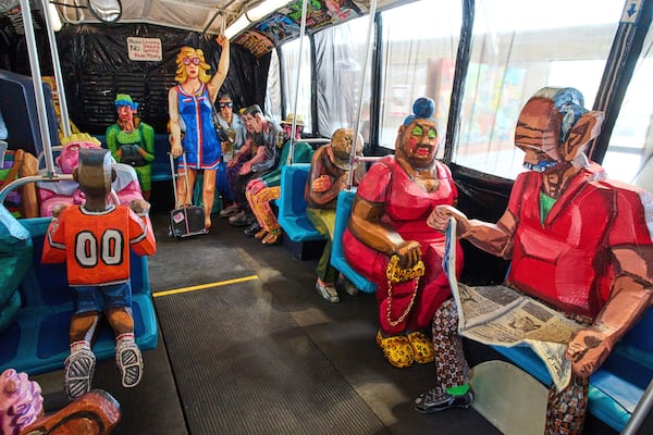 Interior view of The Bus by Red Grooms during a press preview at the Fenix Migration Museum in Rotterdam, Netherlands, Wednesday, May 14, 2025. (AP Photo/Peter Dejong)