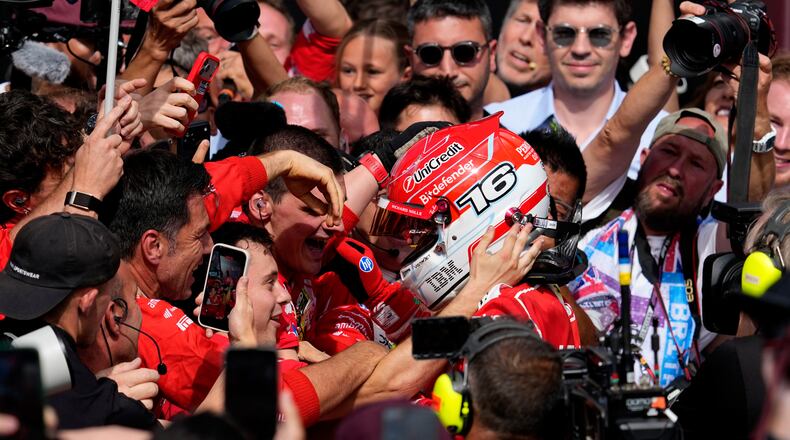 Ferrari driver Charles Leclerc of Monaco celebrates with his team after winning the British F1 Grand Prix, in Silverstone, England, Sunday, July 5, 2026. (AP Photo/Darko Bandic)