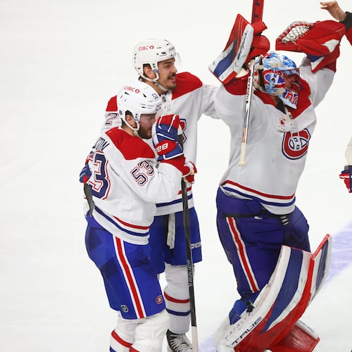 Montreal Canadiens players celebrate victory following the overtime period in Game 7 of a second-round NHL hockey Stanley Cup playoff series against the Buffalo Sabres, Monday, May 18, 2026, in Buffalo, N.Y. (AP Photo/Jeffrey T. Barnes)