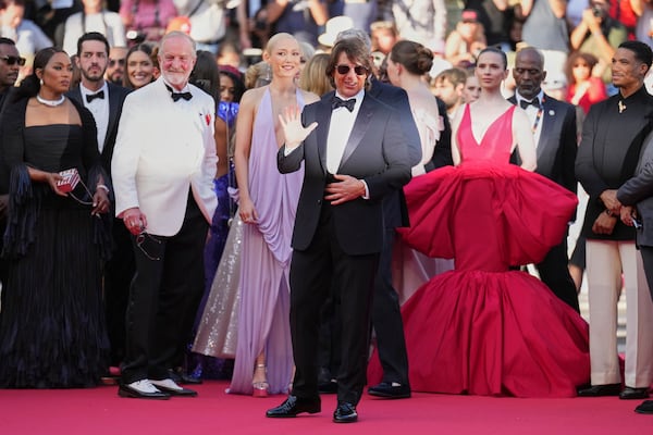 Angela Bassett, from left, writer Erik Jendresen, Pom Klementieff, Tom Cruise, Hayley Atwell, and Greg Tarzan Davis pose for photographers upon arrival at the premiere of the film 'Mission: Impossible - The Final Reckoning' at the 78th international film festival, Cannes, southern France, Wednesday, May 14, 2025. (AP Photo/Natacha Pisarenko)