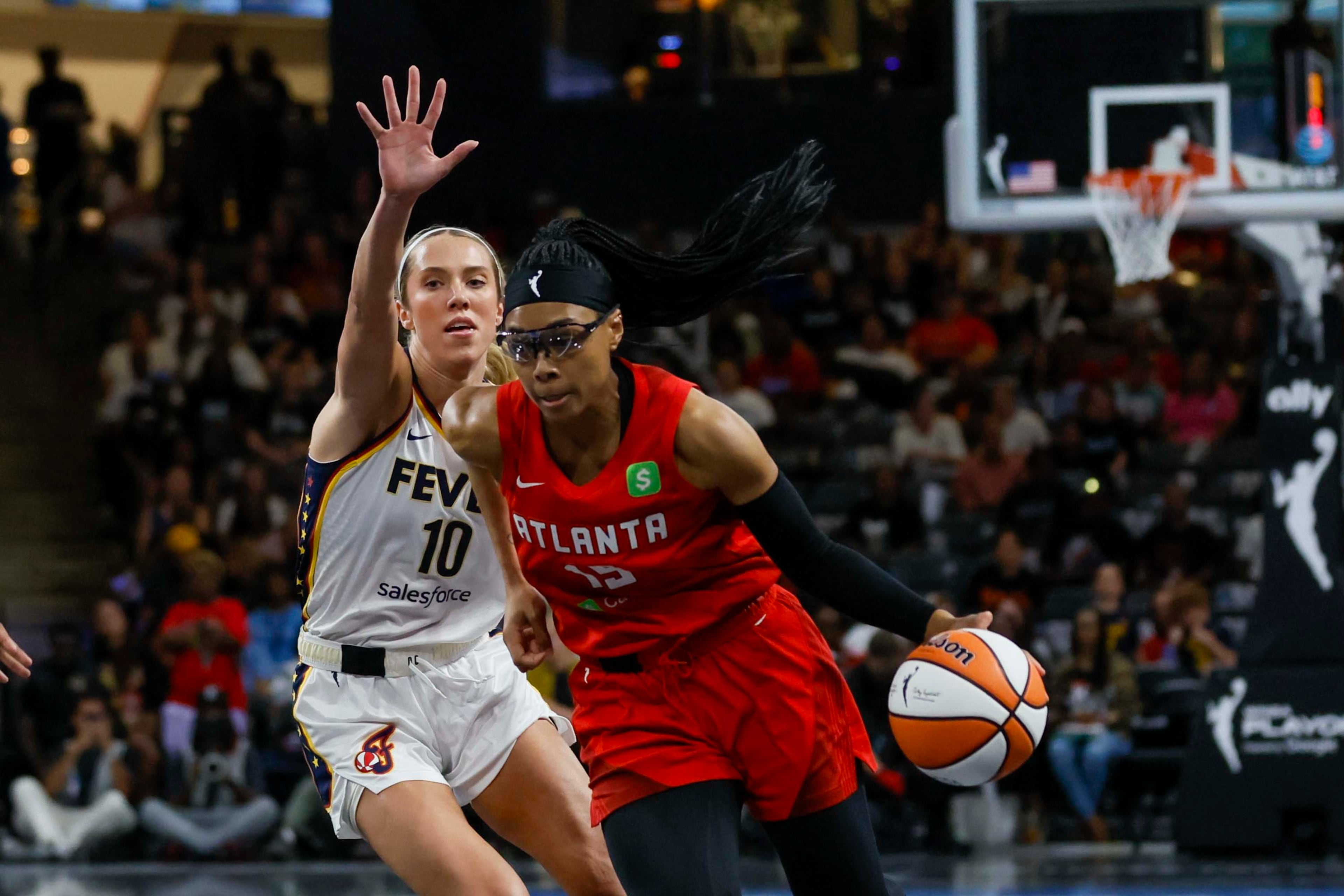 Atlanta Dream guard Allisha Gray (15) dribbles against Indiana Fever guard Lexie Hull (10) during the first half of a WNBA first-round playoff game at Gateway Center Arena on Thursday, Sept. 18, 2024, in Atlanta. (Miguel Martinez/ AJC)