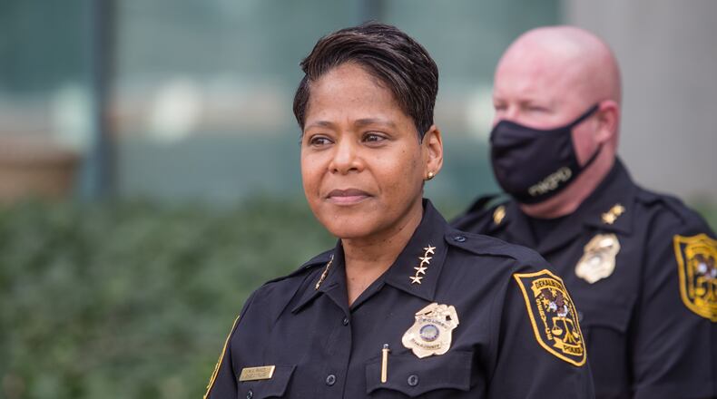 DeKalb County Police Chief Mirtha Ramos, at podium, leads a press conference Thursday, March 18, 2021 announcing the reunion of 1-year-old Royalty Grisby with her mother after the child was taken by a 14-year-old in a stolen car 12 hours earlier.  (Jenni Girtman for The Atlanta Journal-Constitution)