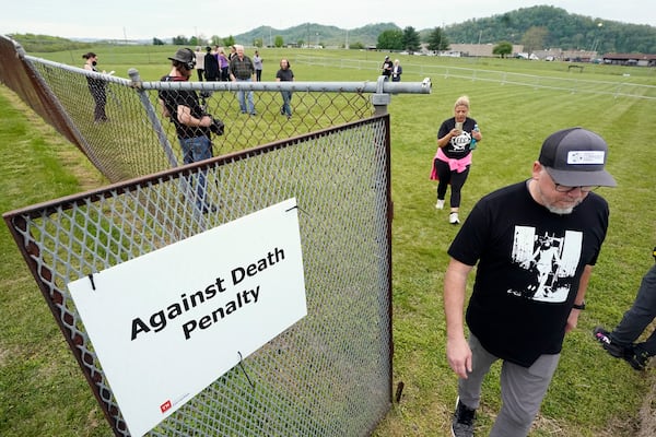 FILE - People leave the demonstration area set up for capital punishment protesters after an announcement was made that the scheduled execution of inmate Oscar Smith has been delayed, April 21, 2022, in Nashville, Tenn. (AP Photo/Mark Humphrey, File)