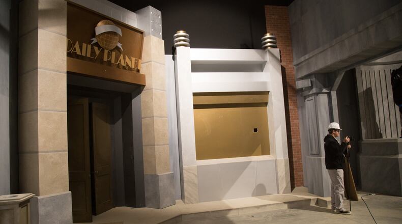 The media mill around the new 4D interactive thrill ride, Justice League: Battle for Metropolis during the recent hard hat day construction tour at Six Flags Over Georgia in Austell. The ride is scheduled to open in May 2017. CONTRIBUTED BY STEVE SCHAEFER