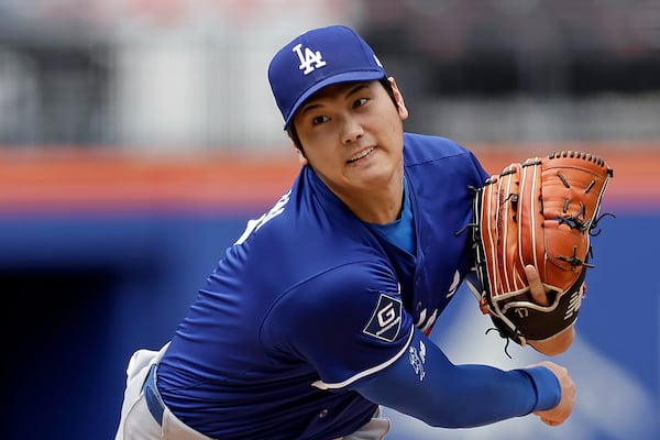 Los Angeles Dodgers' Shohei Ohtani (17), of Japan, throws live batting practice before a baseball game against the New York Mets on Sunday, May 25, 2025, in New York. (AP Photo/Adam Hunger)