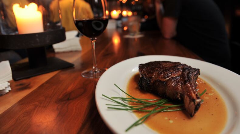 Ribeye and wine on the bar at Kevin Rathbun Steak. (Beckysteinphotography.com)