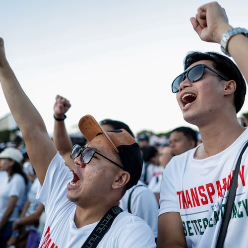 Members of the religious sect Iglesia Ni Cristo (Church of Christ) shout slogans during a three-day anti-corruption rally at Manila's Rizal Park, Philippines on Sunday, Nov. 16, 2025. (AP Photo/Mark Cristino)