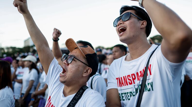 Members of the religious sect Iglesia Ni Cristo (Church of Christ) shout slogans during a three-day anti-corruption rally at Manila's Rizal Park, Philippines on Sunday, Nov. 16, 2025. (AP Photo/Mark Cristino)