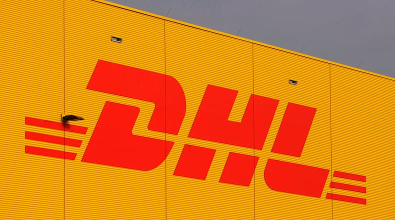 FILE - The logo of German fright company DHL is covered on a terminal at the airport Leipzig/Halle, Jan. 29, 2008. (AP Photo/Matthias Rietschel, File)